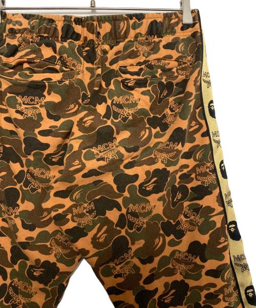 A BATHING APE（ア ベイシング エイプ）A BATHING APE (ア ベイシング エイプ) MCM (エムシーエム) Camo Slim Sweat Pants オレンジ サイズ:Sの古着・服飾アイテム