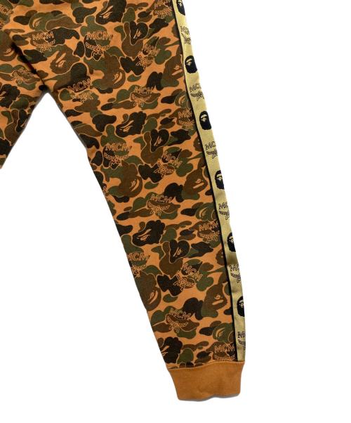 A BATHING APE（ア ベイシング エイプ）A BATHING APE (ア ベイシング エイプ) MCM (エムシーエム) Camo Slim Sweat Pants オレンジ サイズ:Sの古着・服飾アイテム