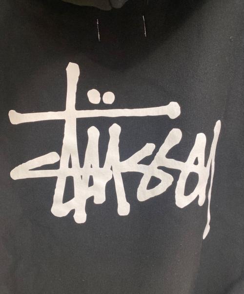 JUNYA WATANABE MAN（ジュンヤワタナベマン）JUNYA WATANABE MAN (ジュンヤワタナベマン) stussy (ステューシー) ダブルネームノースリーブスウェットフーディー ブラック サイズ:M 未使用品の古着・服飾アイテム