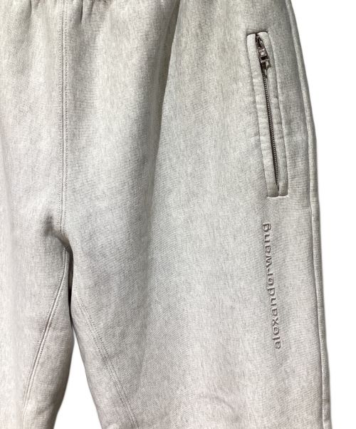 ALEXANDER WANG（アレキサンダー・ワン）ALEXANDER WANG (アレキサンダーワン) Logo Embossed Straight Track Pants（ロゴエンボスストレートトラックパンツ） ライトグレー サイズ:Mの古着・服飾アイテム