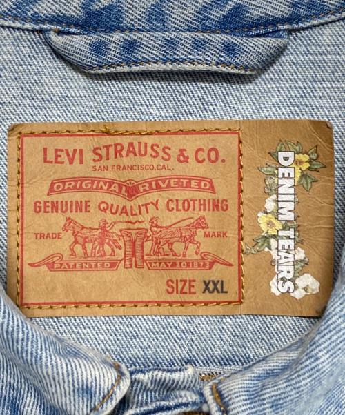 Denim Tears（デニムティアーズ）Denim Tears (デニムティアーズ) LEVI'S (リーバイス) オールオーバーリース ライトウォッシュ デニムトラッカージャケット スカイブルー サイズ:XXLの古着・服飾アイテム