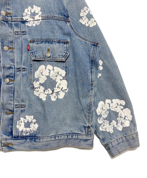 Denim Tears（デニムティアーズ）Denim Tears (デニムティアーズ) LEVI'S (リーバイス) オールオーバーリース ライトウォッシュ デニムトラッカージャケット スカイブルー サイズ:XXLの古着・服飾アイテム