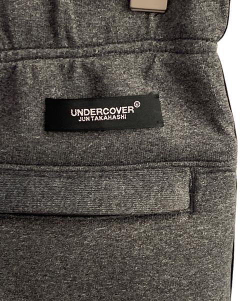UNDERCOVER（アンダーカバー）UNDERCOVER (アンダーカバー) アイモチーフ ジャガードテープトラックパンツ グレー サイズ:2の古着・服飾アイテム