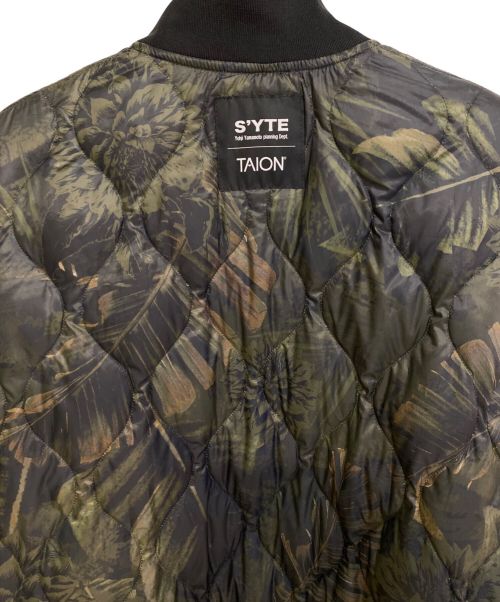 s'yte（サイト）s'yte (サイト) TAION (タイオン) DAHLIA CAMOUFLAGE QUILTED DOWN REVERSIBLE LONG MA-1 ブラック サイズ:2の古着・服飾アイテム