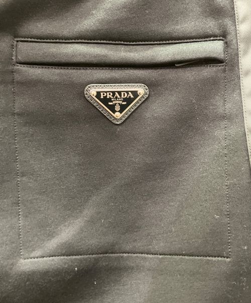 PRADA（プラダ）PRADA (プラダ) サイドテープトライアングルプレートトラックパンツ ブラック サイズ:Mの古着・服飾アイテム