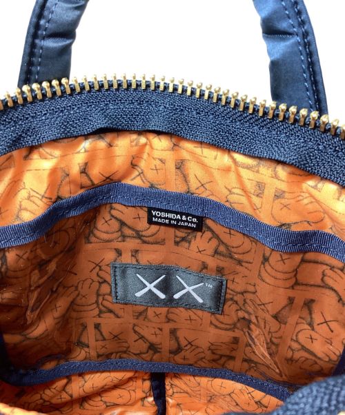 PORTER（ポーター）PORTER (ポーター) KAWS (カウズ) Nylon 2way Bag （ナイロン2WAYバッグ） ネイビーの古着・服飾アイテム