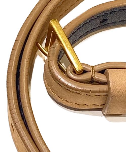 Yves Saint Laurent（イヴサンローラン）Yves Saint Laurent (イヴサンローラン) YSLロゴタッセルムートンミニバッグ ベージュの古着・服飾アイテム