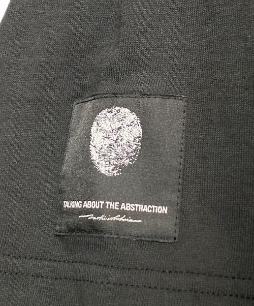 TALKING ABOUT THE ABSTRACTION（トーキング アバウト ジ アブストラクション）TALKING ABOUT THE ABSTRACTION (トーキング アバウト ジ アブストラクション)  IF A GENIUS DREW A GENIUS 1 T-SHIRT ブラック サイズ:XLの古着・服飾アイテム