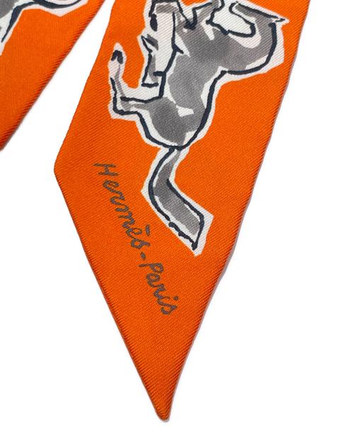 HERMES（エルメス）HERMES (エルメス) ツィリーchevaux en liberte 自由の馬 オレンジの古着・服飾アイテム