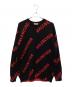 BALENCIAGA（バレンシアガ）の古着「FW20 オールオーバーロゴクルーネックニット」｜ブラック×レッド