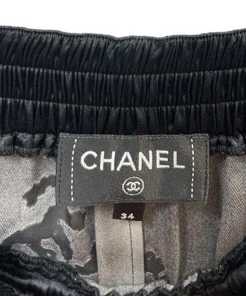 CHANEL（シャネル）CHANEL (シャネル) メティエダールシルク サテン ココマーク ロングスカート ブラック サイズ:34の古着・服飾アイテム