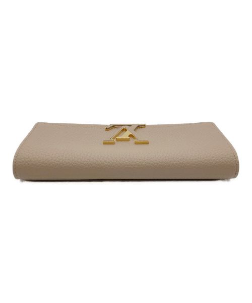 LOUIS VUITTON（ルイ ヴィトン）LOUIS VUITTON (ルイ ヴィトン) ポリトフォイユ カプシーヌ ベージュ 未使用品の古着・服飾アイテム