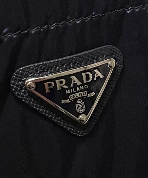 PRADA（プラダ）PRADA (プラダ) 三角プレートダウンジャケット ネイビー サイズ:44の古着・服飾アイテム