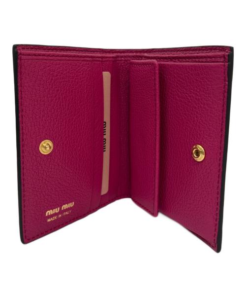 MIU MIU（ミュウミュウ）MIU MIU (ミュウミュウ) ロゴジャガードウォレット ピンク×ブラックの古着・服飾アイテム
