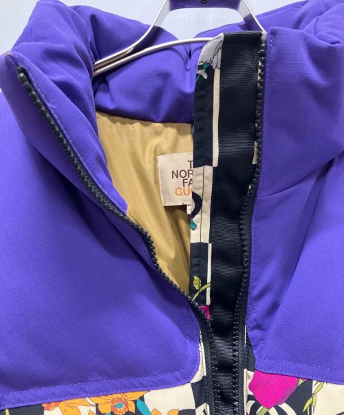 GUCCI×THE NORTH FACE（グッチ×ザノースフェイス）GUCCI×THE NORTH FACE (グッチ×ザノースフェイス) フラワーロゴ総柄ダウンジャケット パープル サイズ:XL 未使用品の古着・服飾アイテム