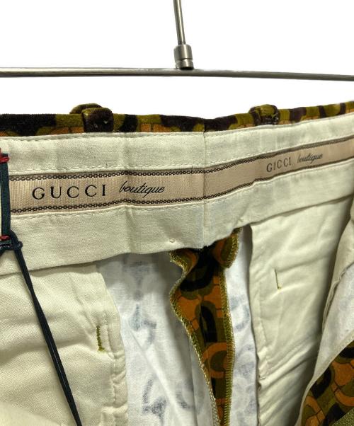 GUCCI（グッチ）GUCCI (グッチ) 100周年 総柄ベロアフレアパンツ オレンジ×カーキ サイズ:50の古着・服飾アイテム