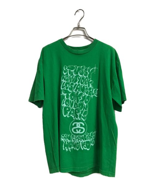 stussy（ステューシー）stussy (ステューシー) KAWS (カウズ) 半袖Tシャツ グリーン サイズ:Lの古着・服飾アイテム