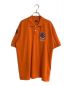 AVIREX（アヴィレックス）の古着「TOP GUN FLAG/トップガンフラッグポロシャツ」｜オレンジ
