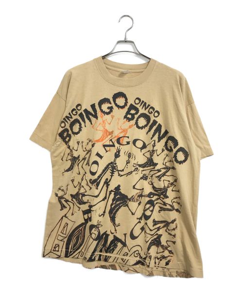 バンドTシャツ（バンドTシャツ）バンドTシャツ (バンドTシャツ) [古着]Oingo boingo オールオーバープリントバンドTシャツ ベージュ サイズ:XXLの古着・服飾アイテム