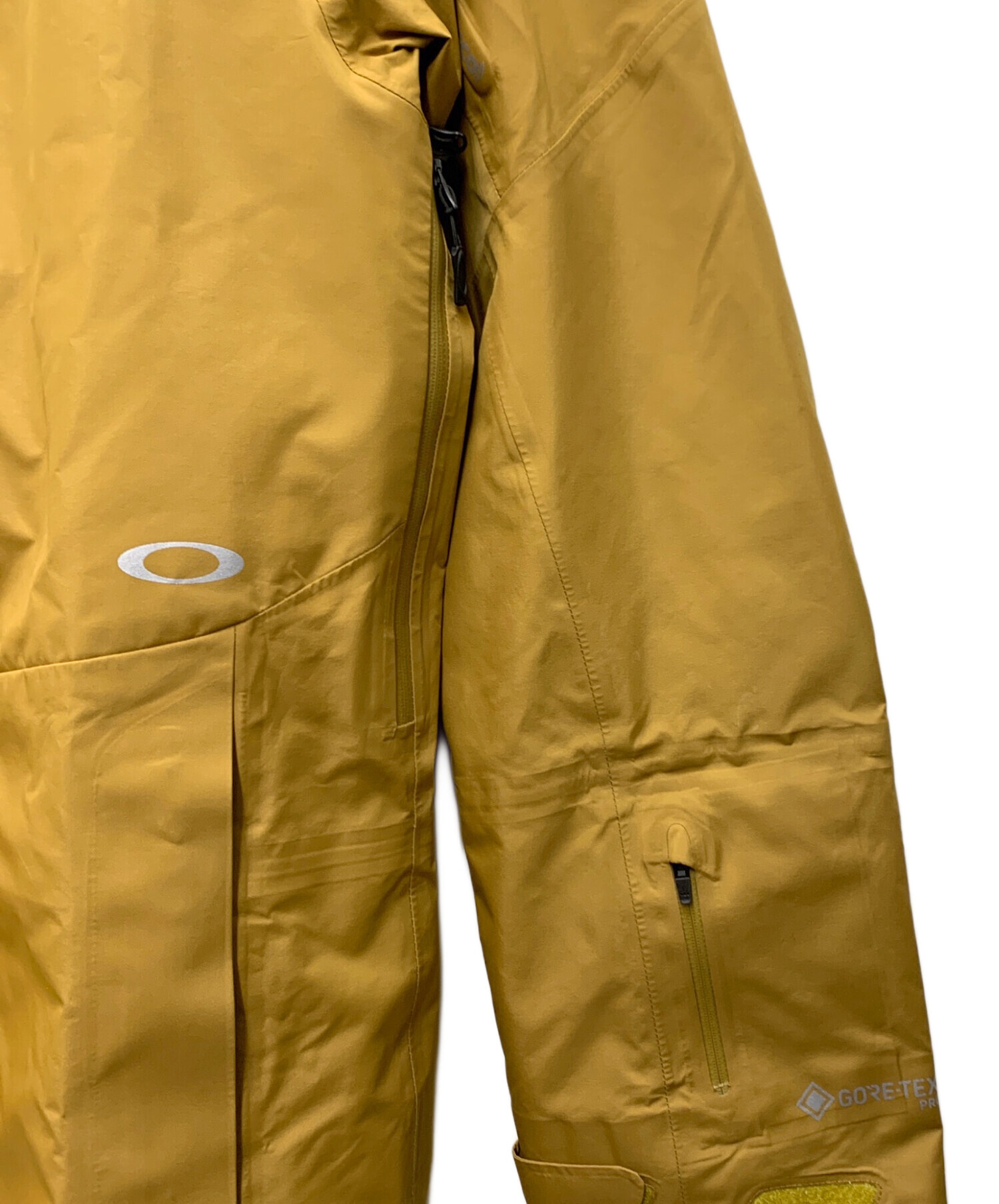 中古・古着通販】OAKLEY (オークリー) マウンテンパーカー ベージュ