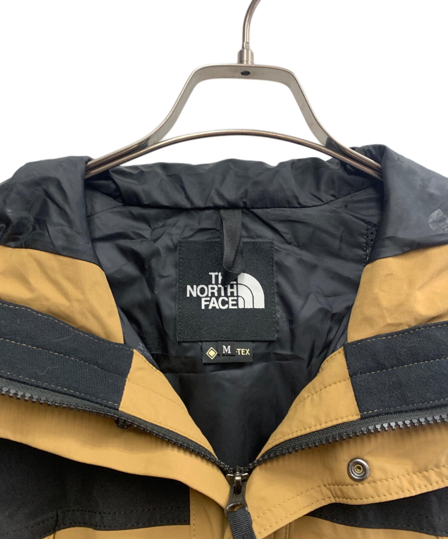 【ほぼ未使用】THE NORTH FACEマウンテンパーカー ブラック・ブラウン 中古・古着通販】THE NORTH FACE (ザ ノース フェイス) マウンテン