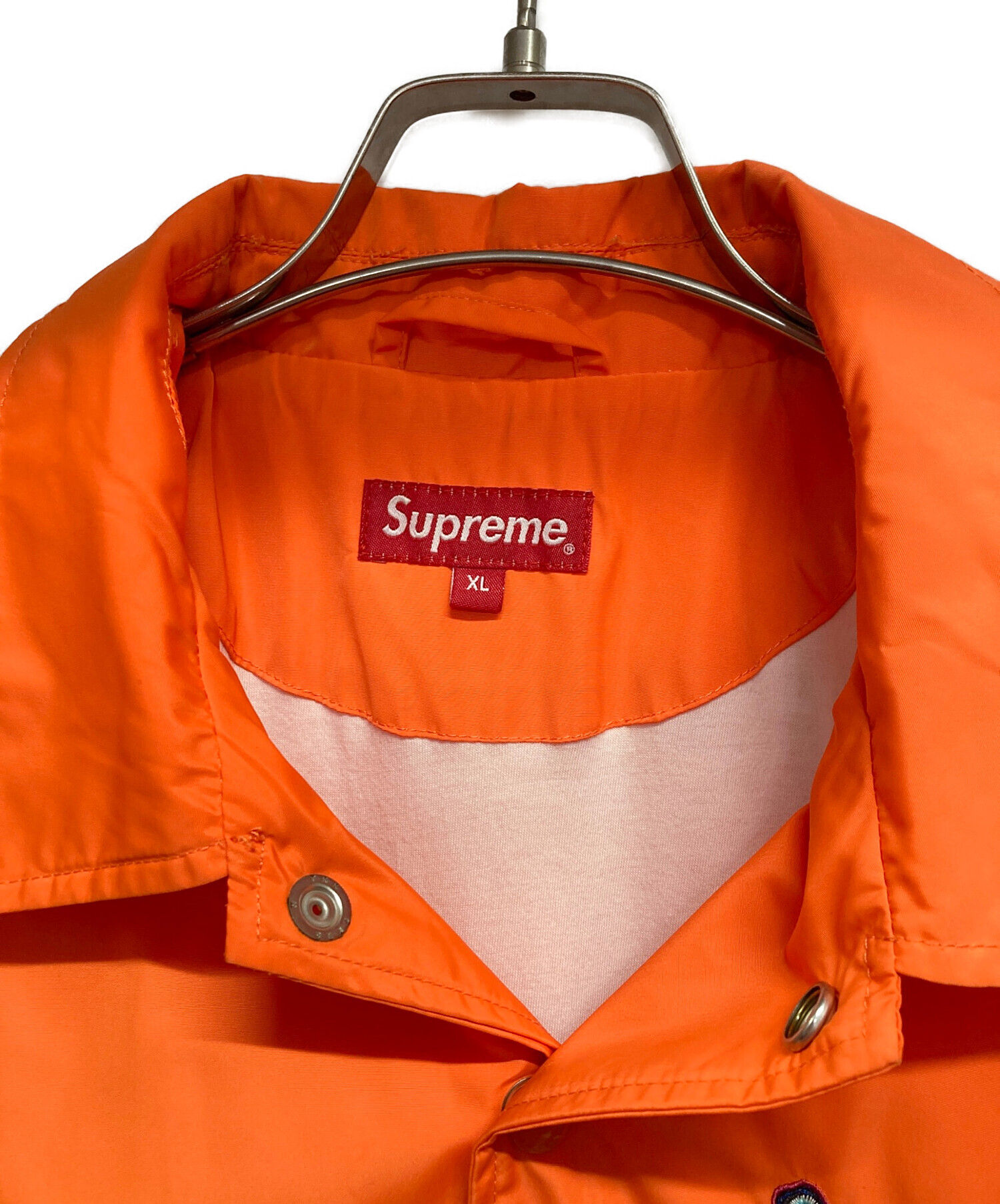 Supreme コーチジャケット ワールドフェイマス バックプリント オレンジ 中古・古着通販】SUPREME (シュプリーム) コーチジャケット オレンジ