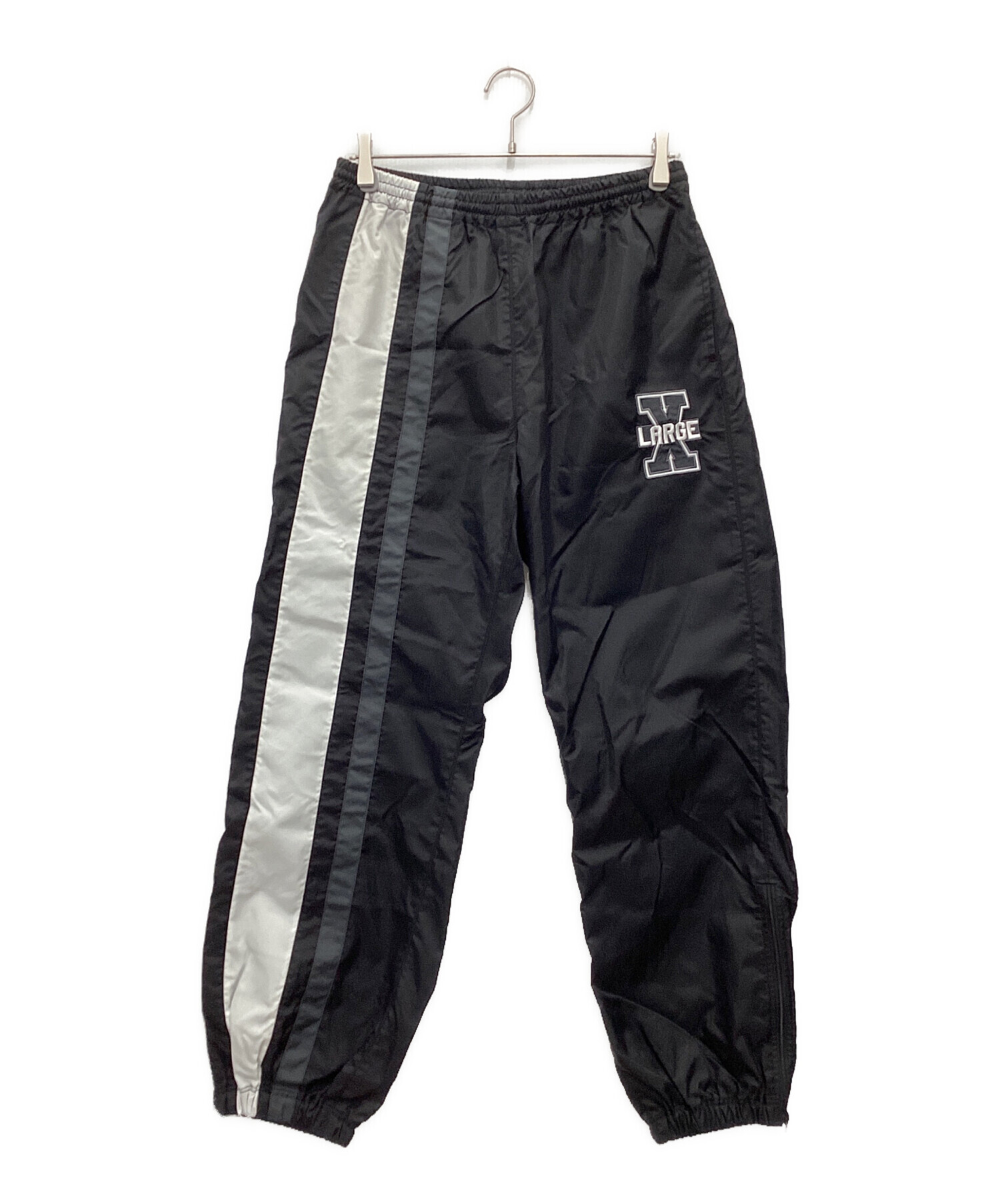 XLARGE ブラック ファイヤーパターン　セットアップ トラックパンツ　XXL 中古・古着通販】X-LARGE (エクストララージ) ナイロンパンツ ブラック