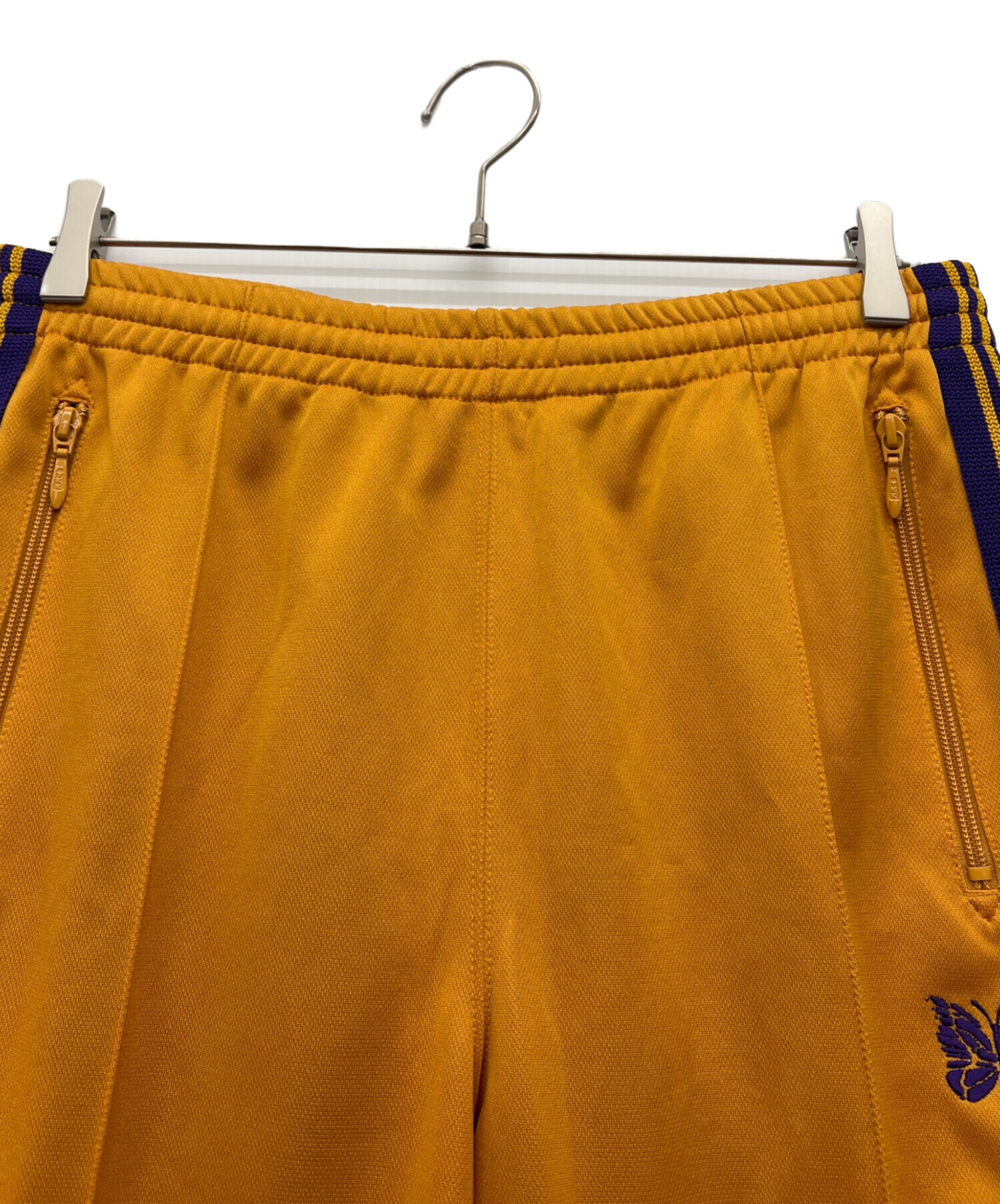 中古・古着通販】Needles (ニードルズ) ナロートラックパンツ オレンジ