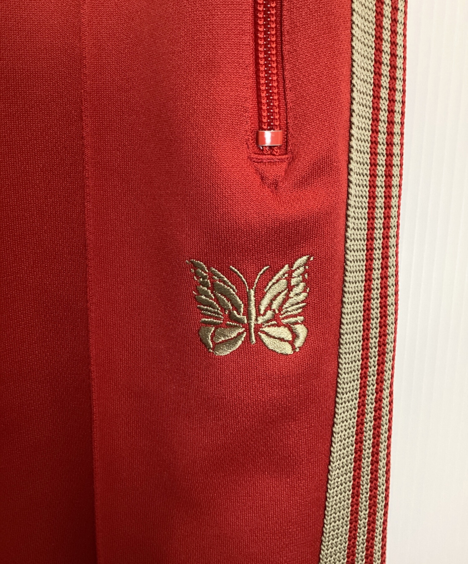 中古・古着通販】Needles (ニードルズ) トラックパンツ レッド サイズ