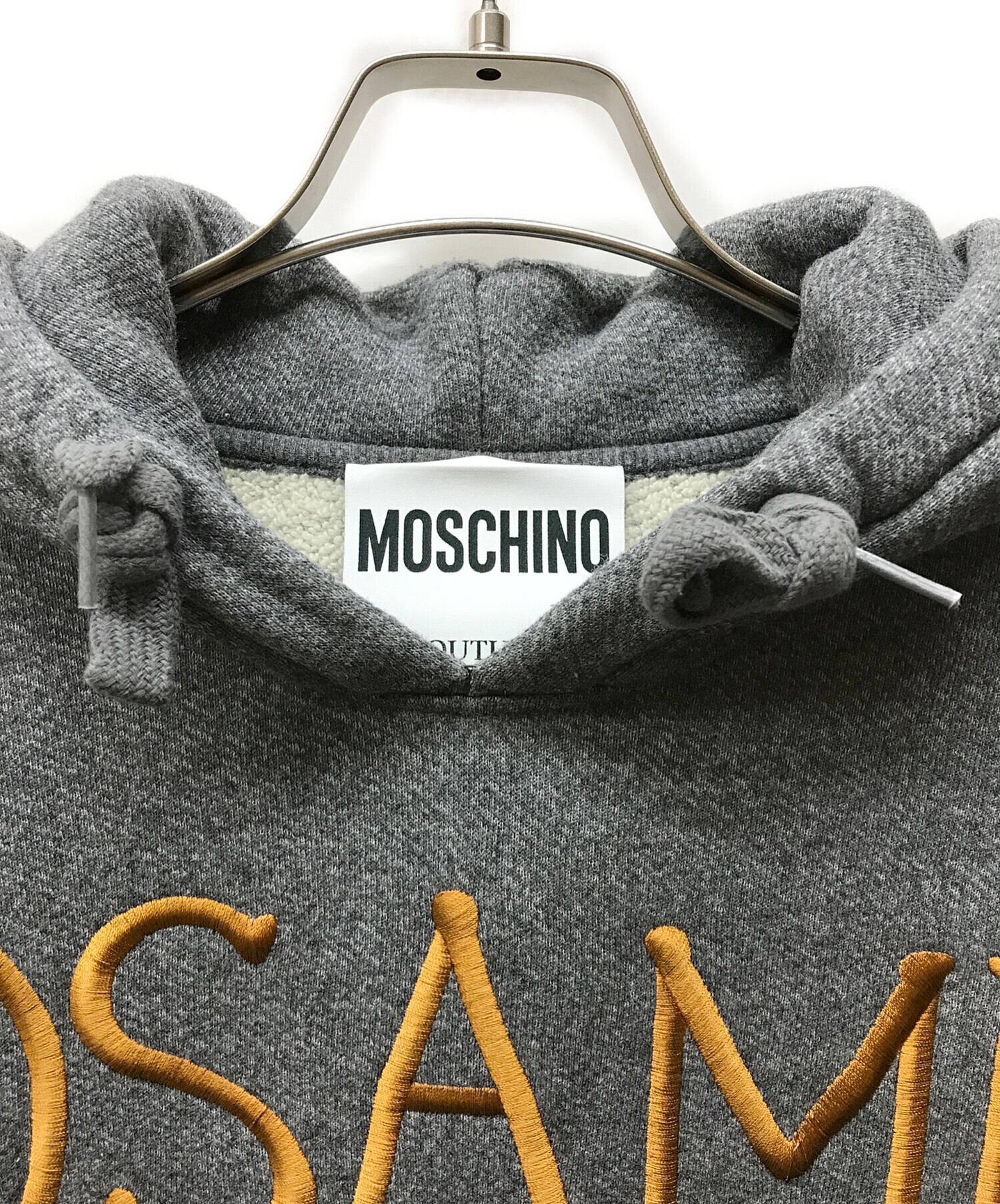 MOSCHINO モスキーノ パーカー M グレー 【古着】【中古】【送料無料】 中古・古着通販】MOSCHINO (モスキーノ) パーカー グレー サイズ:46