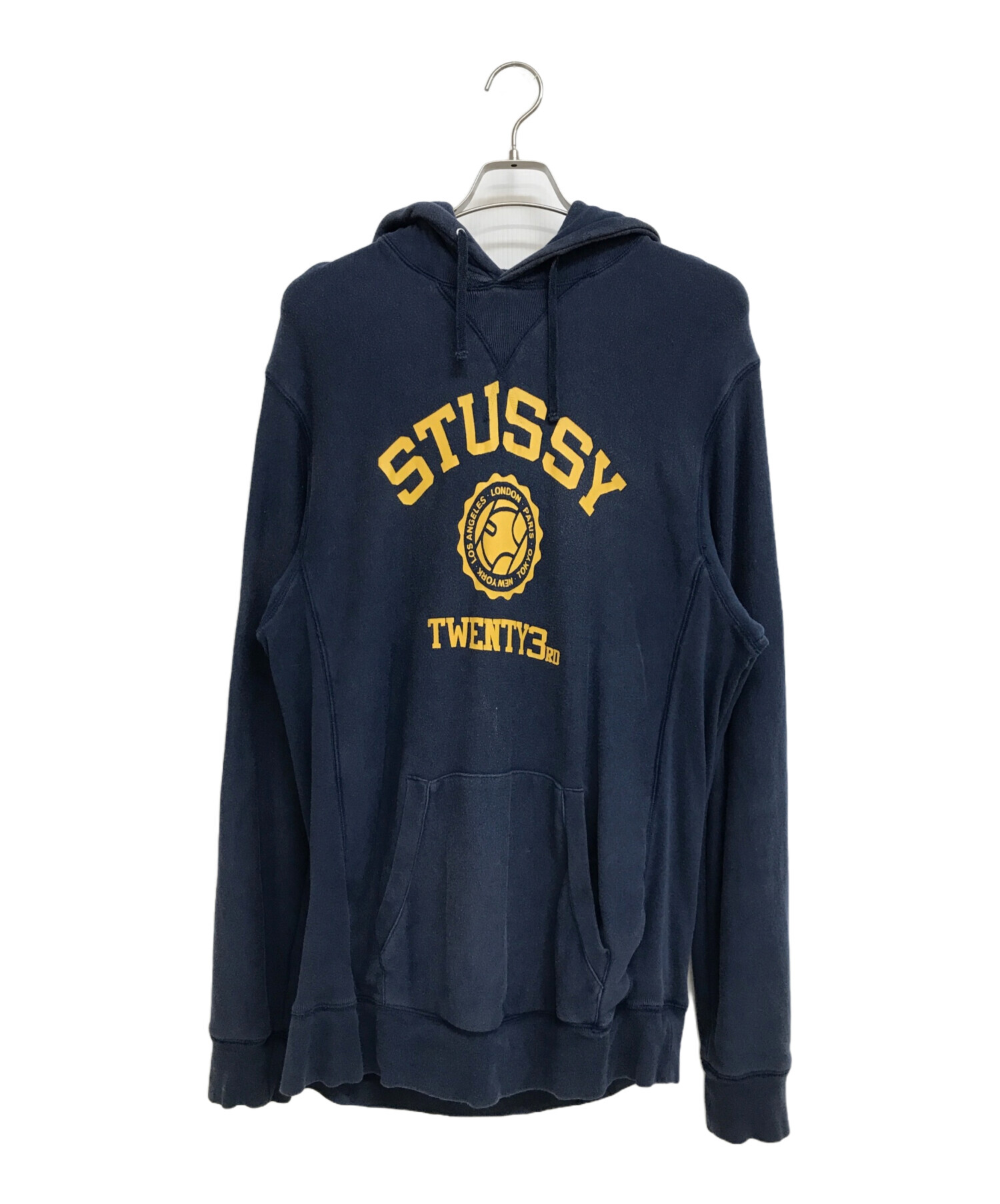 STUSSY ネイビー フード付きパーカー 中古・古着通販】stussy (ステューシー) カレッジプリント