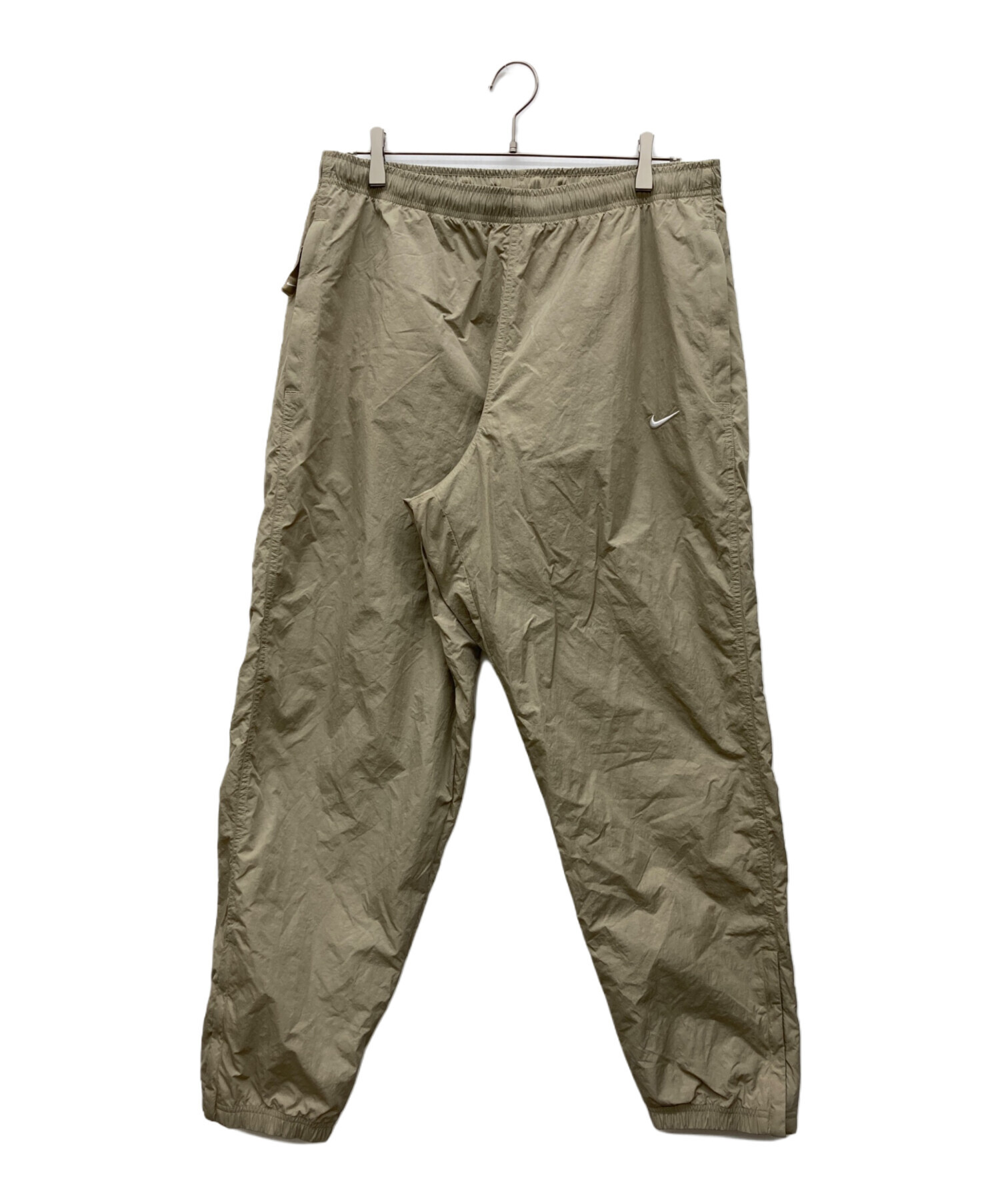 NIKE ナイロンパンツ ベージュ ブラック 中古・古着通販】NIKE (ナイキ) ナイロンパンツ ベージュ サイズ:L