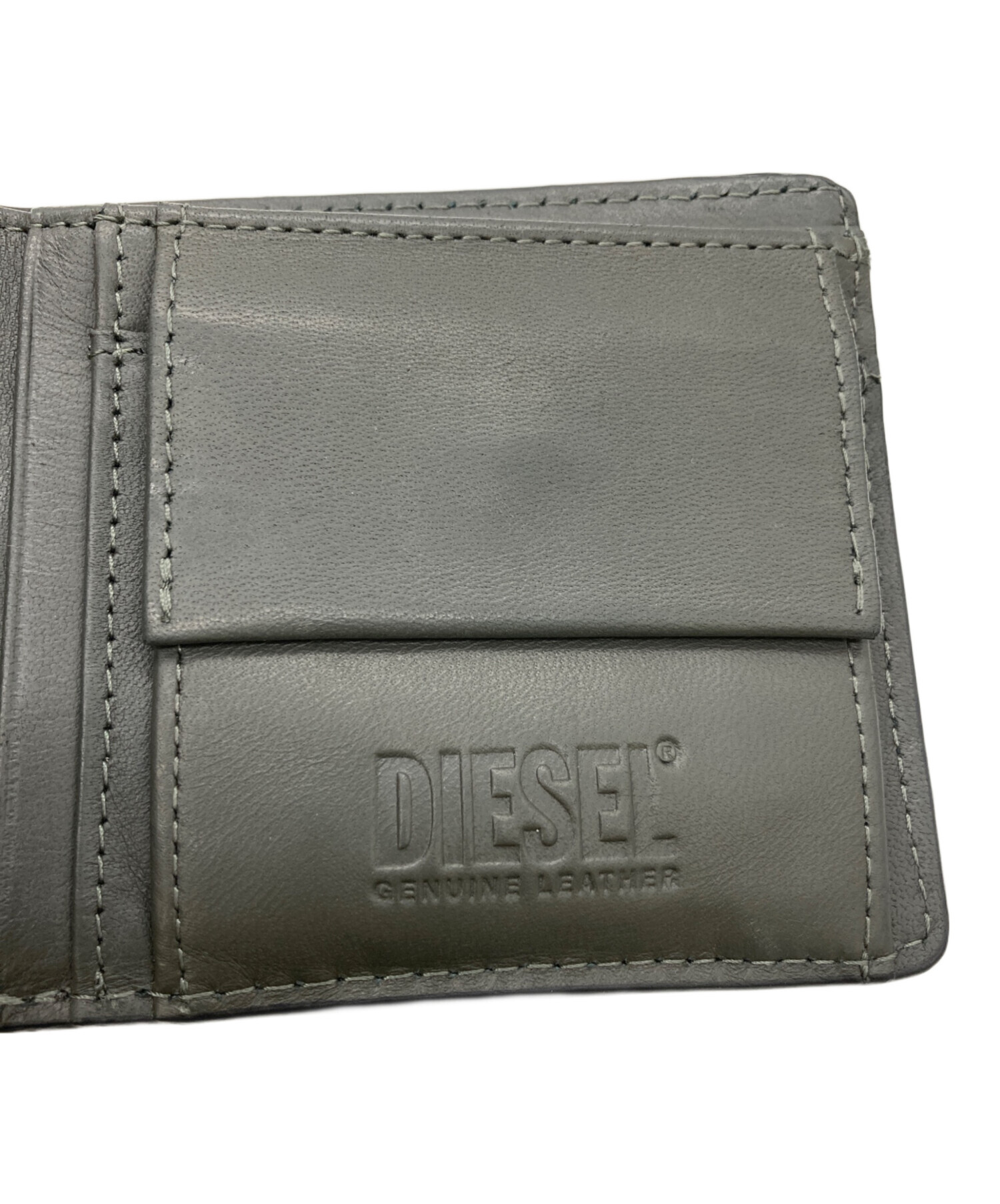 【未使用】 ディーゼル ラウンドジップ エンボス デカロゴ 中古・古着通販】DIESEL (ディーゼル) ロゴモノグラムエンボス