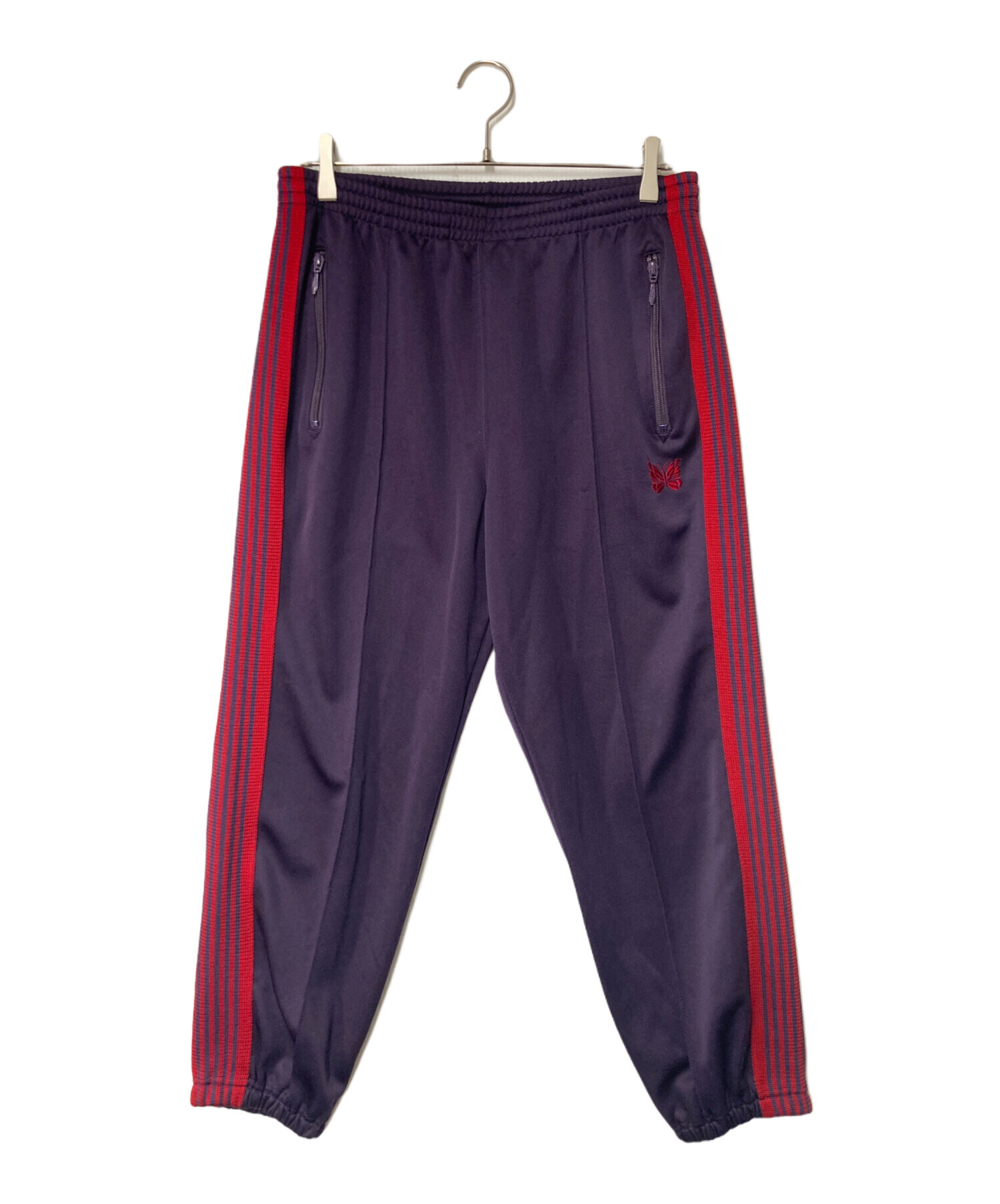 NEEDLES 赤パンツ 中古・古着通販】Needles (ニードルズ) ZIPPED TRACK PANT パープル