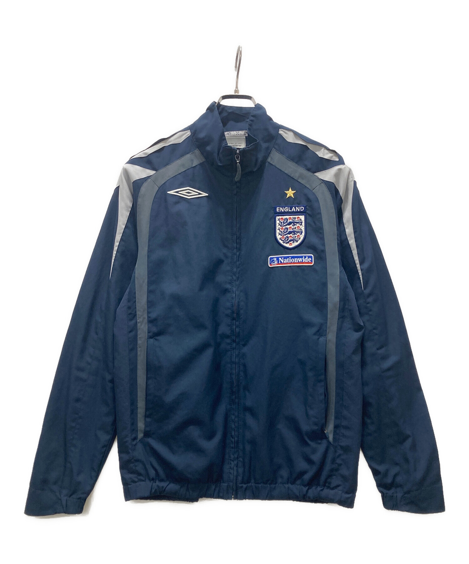 古着UMBROトラックジャケット企業テープロゴネイビージャージ 中古・古着通販】UMBRO (アンブロ) トラックジャケット ネイビー