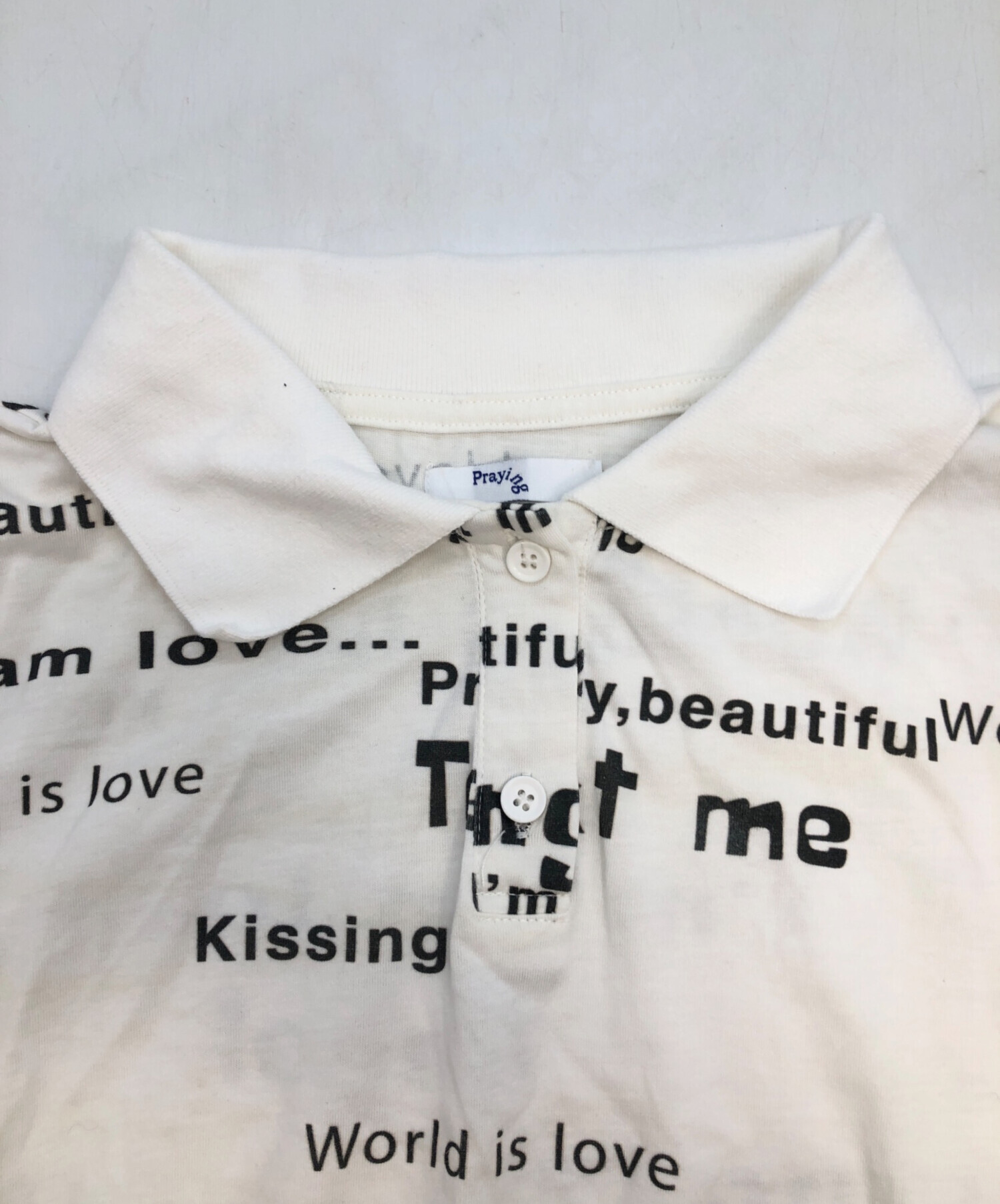 トップス praying world is love womans polo 中古・古着通販】Praying (プレイング) World Is Love Womens Polo